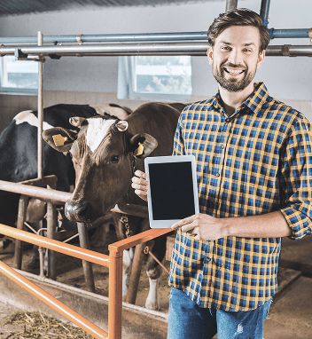 Farmer presenting a tablet in the field