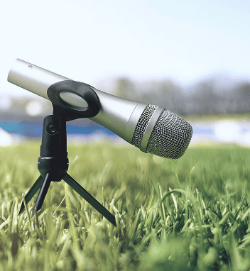 Microphone on a stand in a grassy field